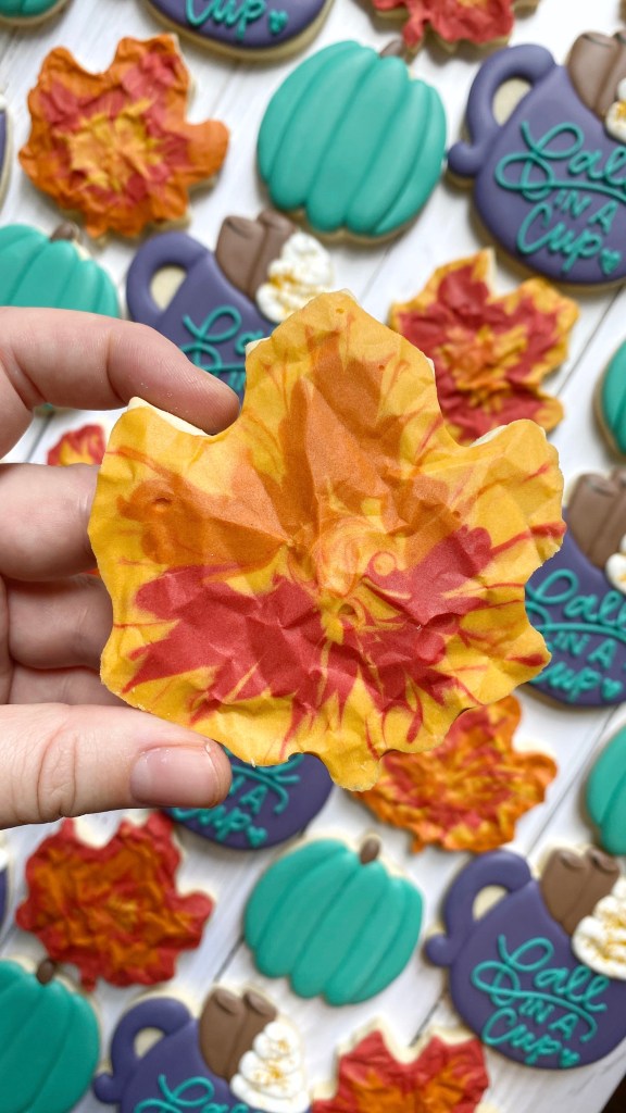 maple leaf cookie decorated with royal icing 