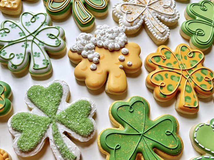 photo of royal icing cookies with a variety of different consistencies 