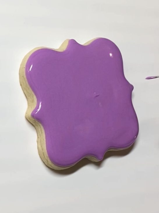 step 1 of decorating love birds cookies with royal icing