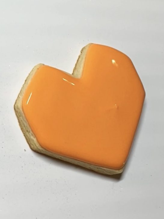 step 1 of decorating heart cookies with royal icing