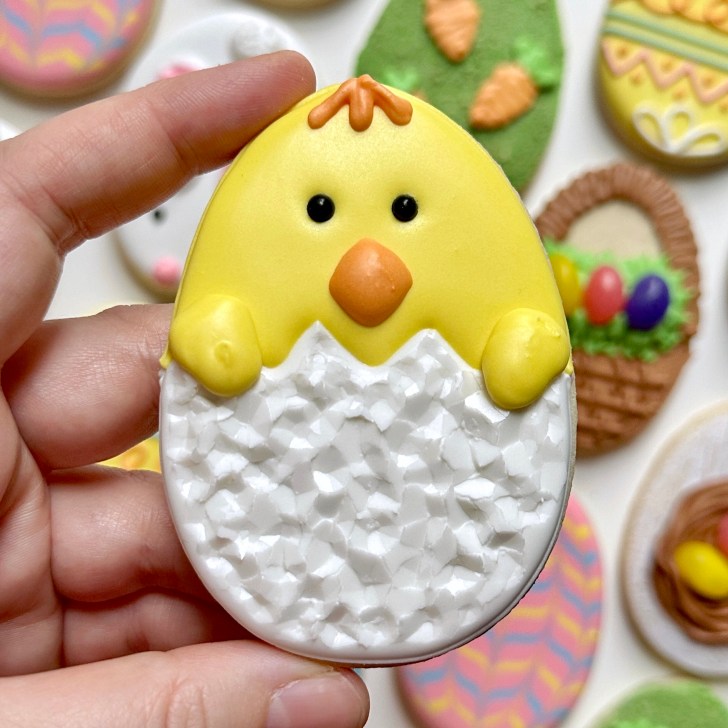 chick easter egg sugar cookie decorated with royal icing 