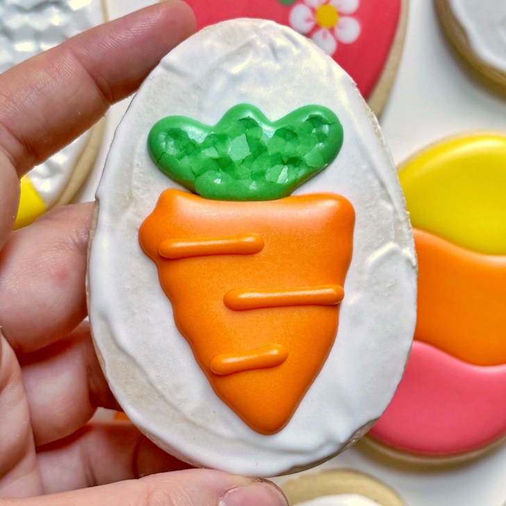 carrot easter egg sugar cookie decorated with royal icing 