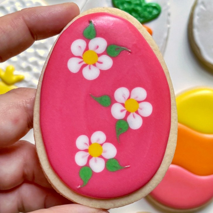 flower easter egg cookie decorated with royal icing