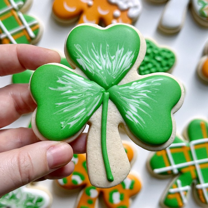 easy shamrock cookie decorated with royal icing 