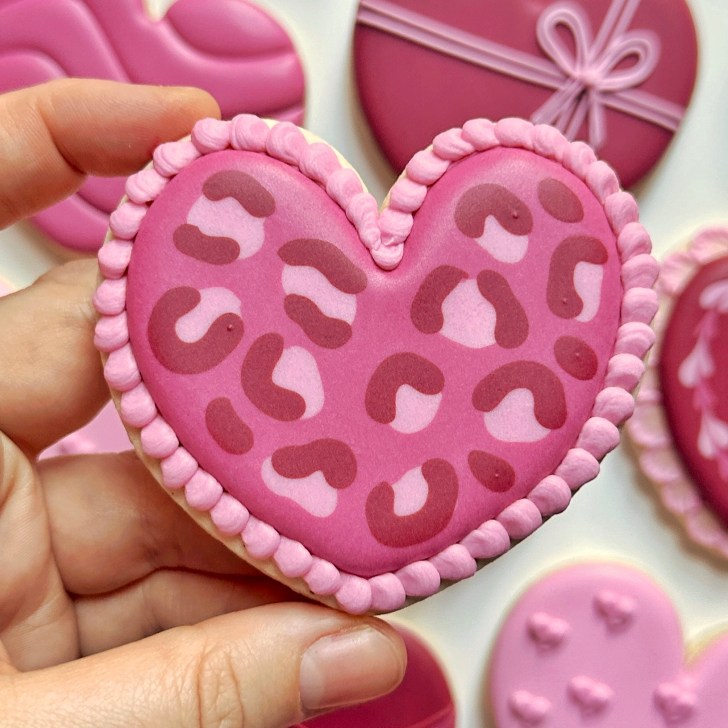 leopard heart cookies decorated with royal icing