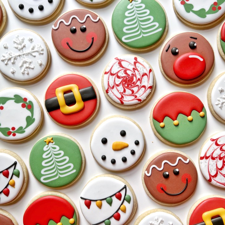 photo of christmas circle sugar cookies decorated with royal icing