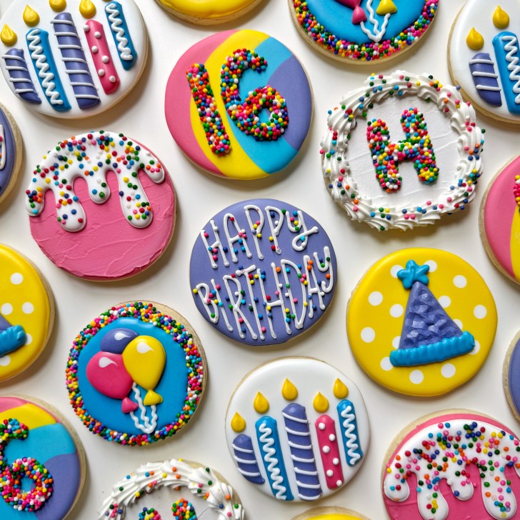 photo of birthday circle sugar cookies decorated with royal icing
